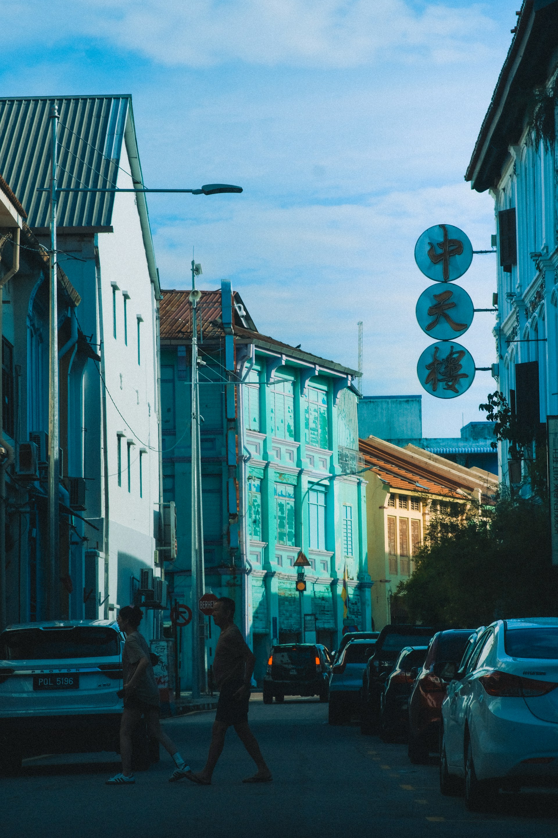 Colourful shophouses and a street scene in George Town, Penang