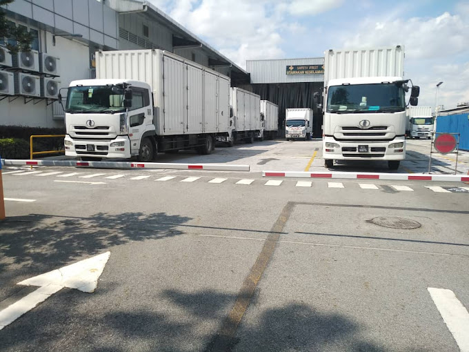 Sun Wiprov website photo of commercial trucks outside a logistics building